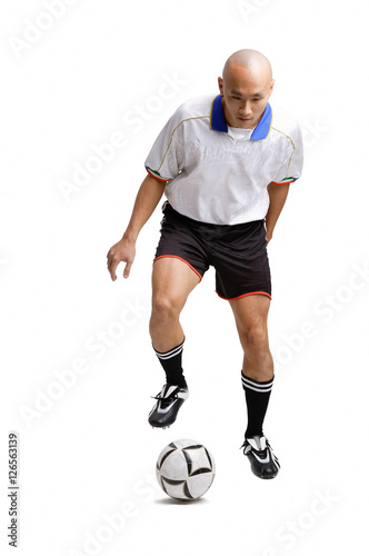 Young man playing with soccer ball