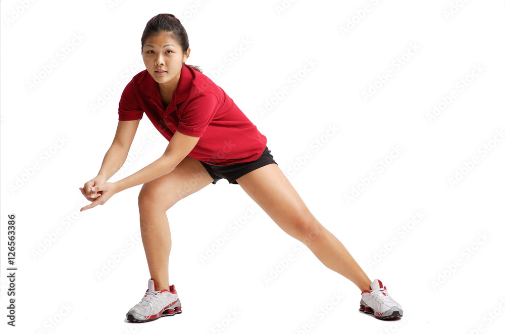 Young woman waiting for volleyball to come her way, hands clasped Young woman waiting for volleyball to come her way, hands clasped