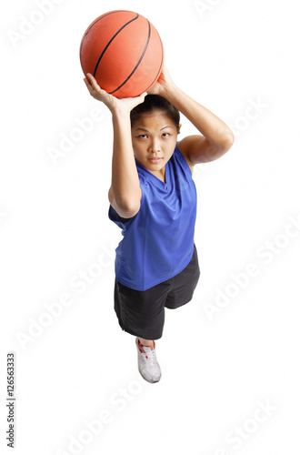 Young woman with basketball, aiming for a shoot