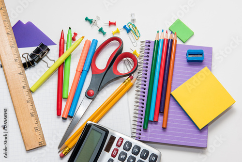 Assortment of school supplies isolated on a white background