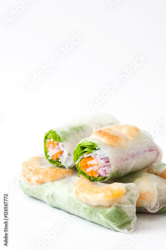 Vietnamese rolls with vegetables, rice noodles and prawns isolated on white background 