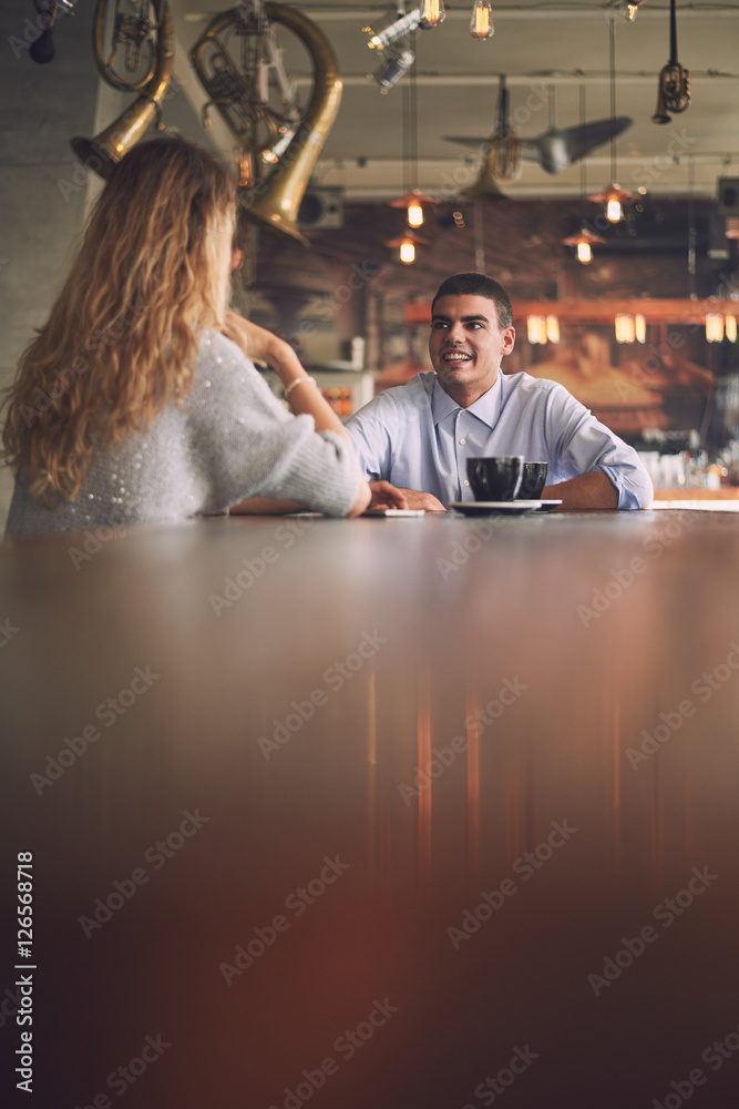 Two friends talking in the cafe