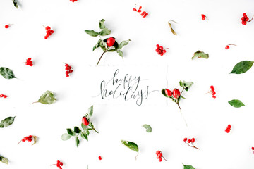 words happy holidays and minimal creative berry arrangement pattern on white. flat lay, top view. christmas background wallpaper.