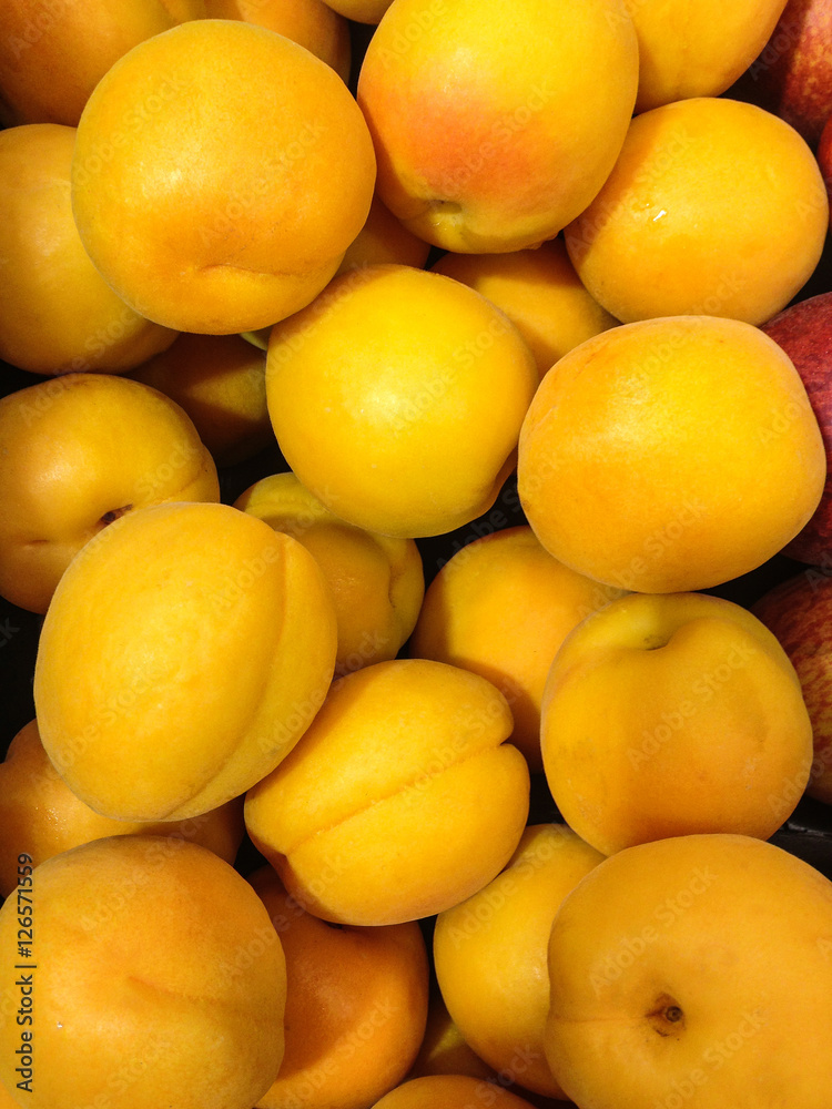 Group of plump ripe peaches