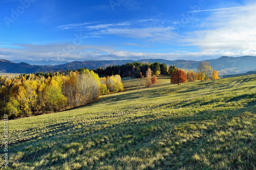 Fall in Slovakia. Meadows and fields landscape. Autumn color trees.