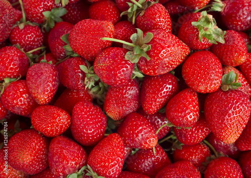 Strawberries. Background from fresh strawberries, Red strawberries. Strawberries at market. Strawberries fruits. Healthy strawberries.(selective focus)