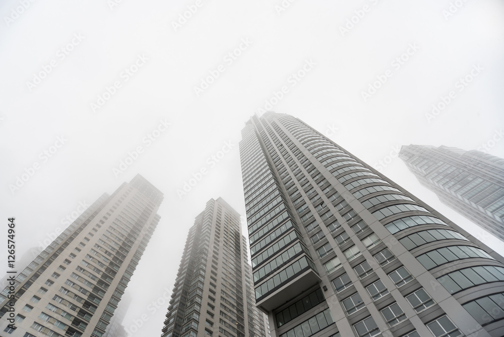Downtown skyscrapers under the fog upward view at the Puerto Madero. Downtown skyscrapers under the fog upward view at the Puerto Madero.