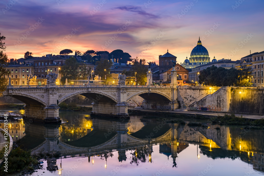 St. Peter's cathedral (Basilica di San Pietro) and bridge (Ponte Vittorio Emanuele II) over river Tiber in the evening after sunrise, Rome, Italy, Europe