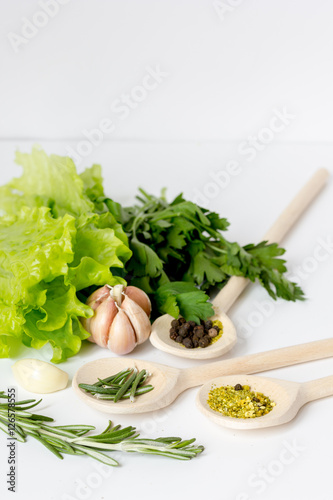 fresh salad with garlic and spices on white background