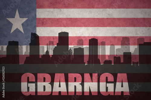 abstract silhouette of the city with text Gbarnga at the vintage liberian flag