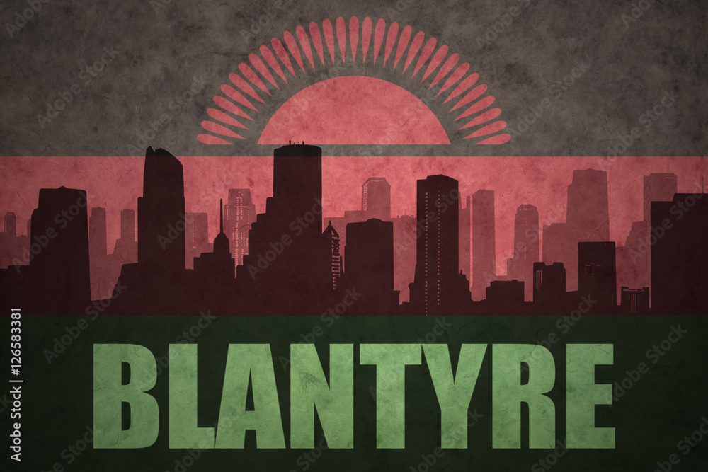 abstract silhouette of the city with text Blantyre at the vintage malawi flag