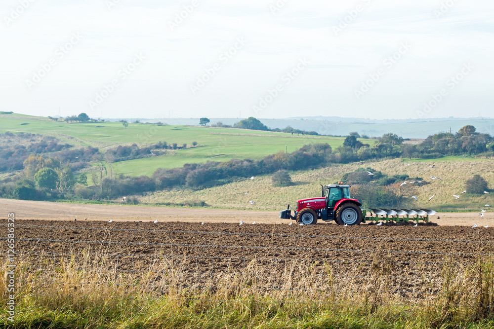 Fototapeta premium Tractor Ploughing Field