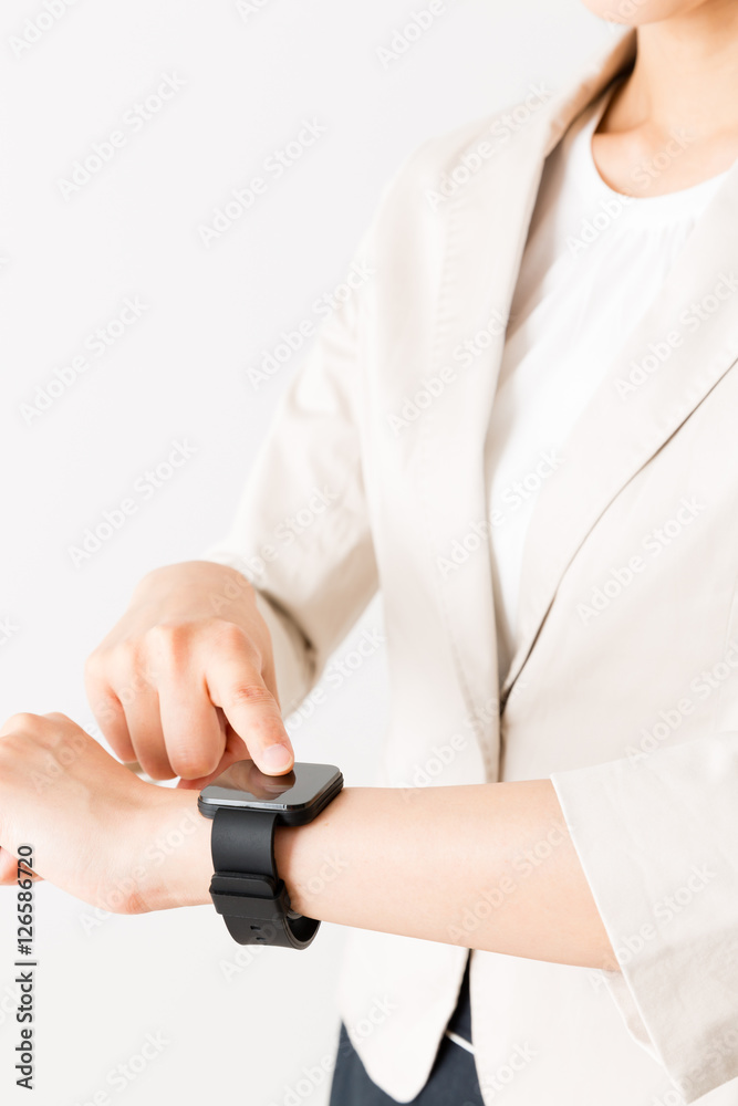 portrait of asian businesswoman using smart watch isolated on white background