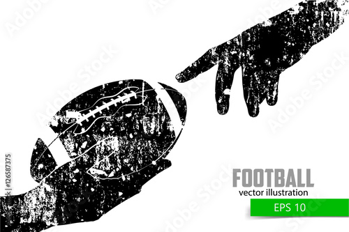 Hand holds the rugby ball, silhouette