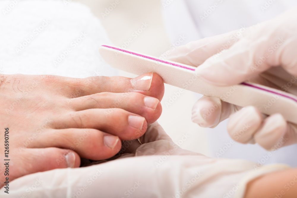Beautician Hand Filling Person's Nail Beautician Hand Filling Person's Nail