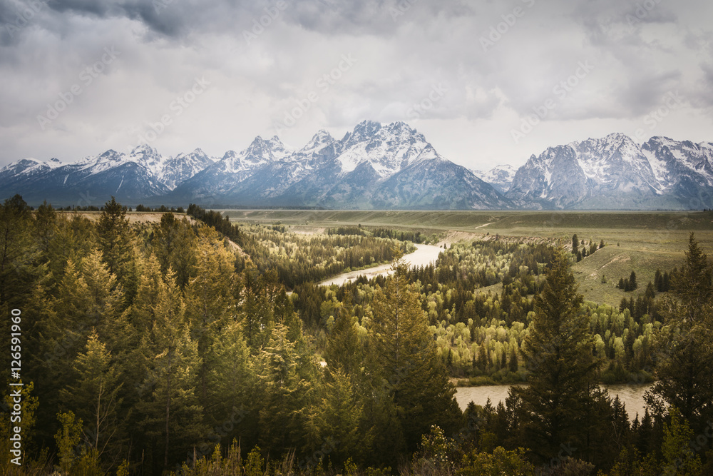Fototapeta premium A Mountain Range and Snake River, Grand Teton National Park, USA. Landscape is unique and part of Rocky Mountain. Grand Teton National Park is also popular among landscape and nature photographer