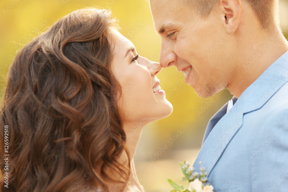 Portrait of beautiful wedding couple on blurred background Portrait of beautiful wedding couple on blurred background