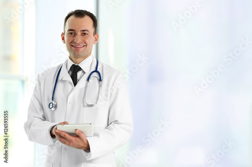 Doctor with tablet at hospital