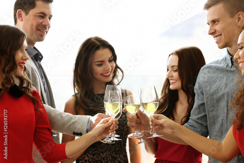 People toasting with glasse...