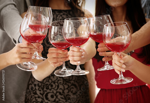 People toasting with glasse...