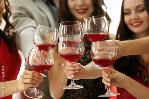 People toasting with glasse...
