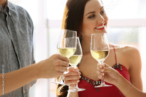 People toasting with glasse...
