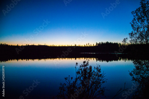 Sunset behind the lake