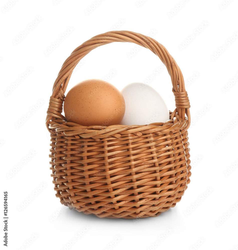Basket with raw eggs on white background Basket with raw eggs on white background
