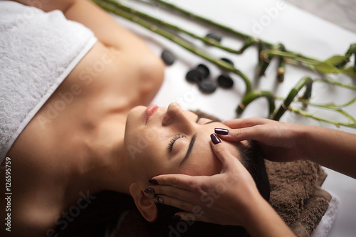 Skin And Body Care. Close-up Of A Young Woman Getting Spa Treatment At Beauty Salon. Spa Face Massage. Facial Beauty Treatment. Spa Salon.