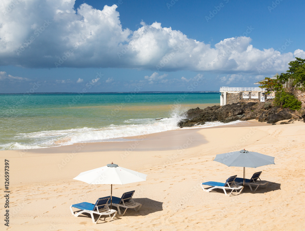 Reclining chairs and umbrella on Baie Rouge