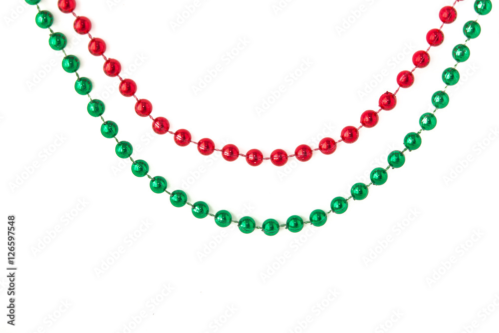 Obraz premium red and green beads on a white background