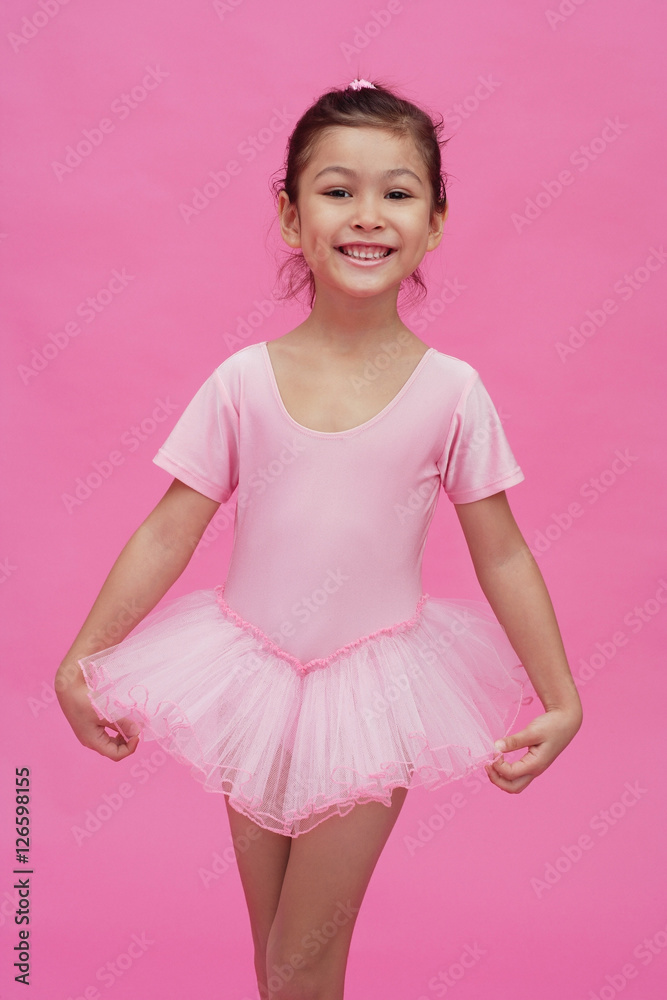 Young girl in ballerina costume, smiling at camera Young girl in ballerina costume, smiling at camera