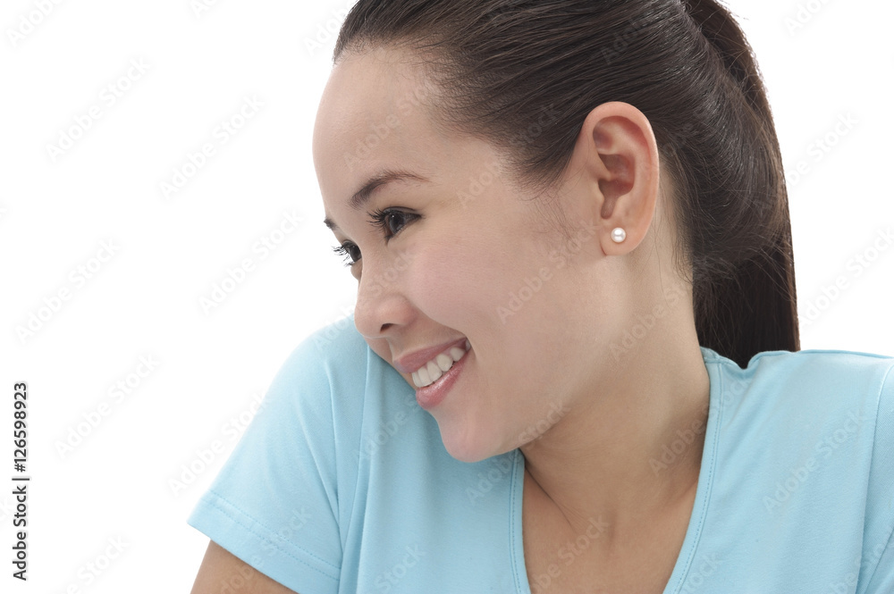 Young woman smiling, looking away, side view Young woman smiling, looking away, side view