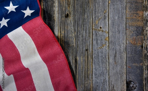 close up of American flag on rustic barn wood