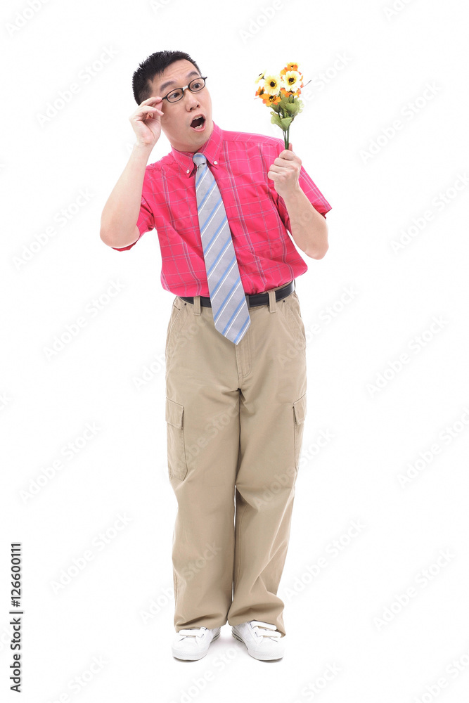 Man in shirt and tie, looking at flower bouquet Man in shirt and tie, looking at flower bouquet