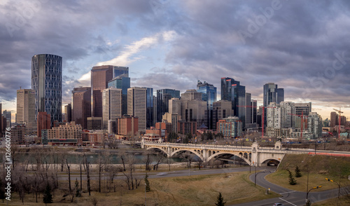 Calgary s skyline at sunrise along the Bow River.
