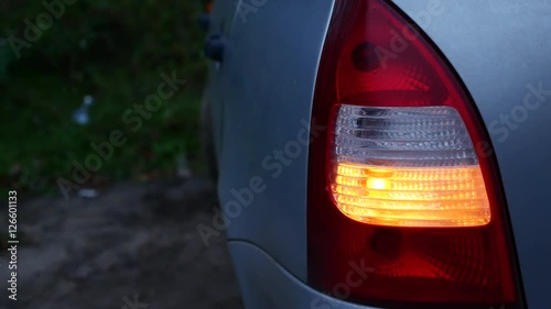 car blinker is blinking in the evening