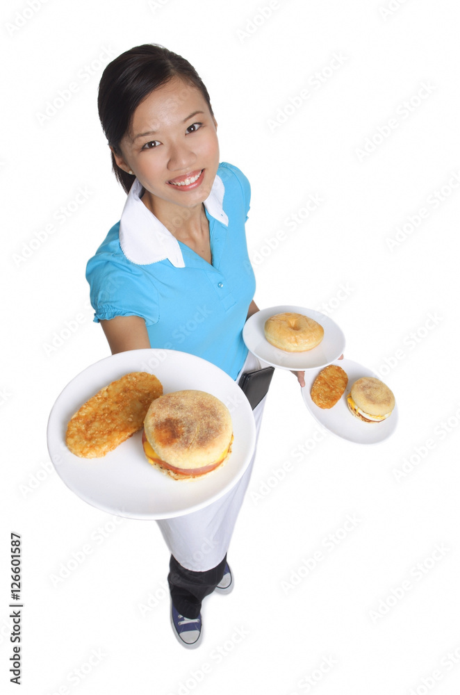 Waitress smiling at camera, serving breakfast Waitress smiling at camera, serving breakfast