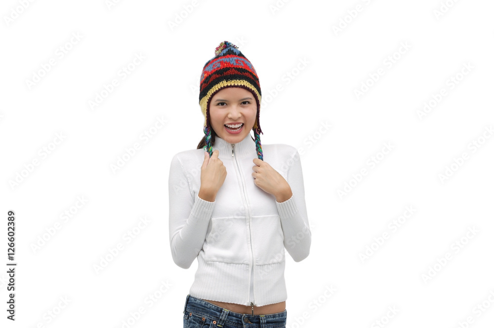 Young woman wearing winter hat, smiling at camera Young woman wearing winter hat, smiling at camera