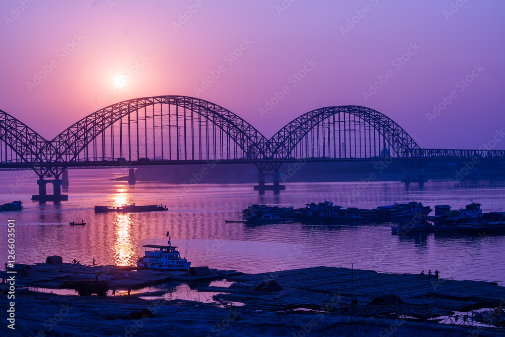 Yadanarbon bridge at sunset over Ayeyarwady River