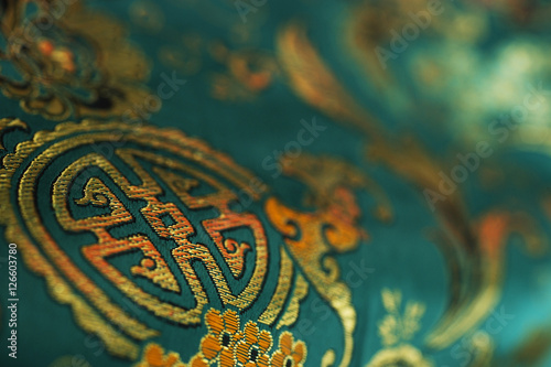 Detail of jade green Chinese silk fabric