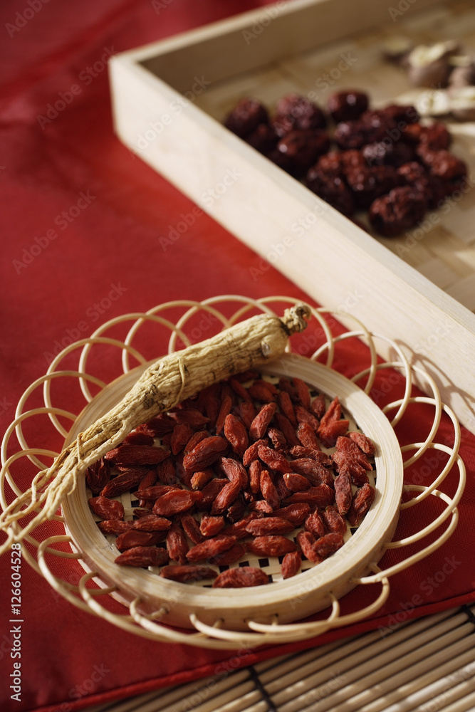 Still life of wolf berries, ginseng and red dates