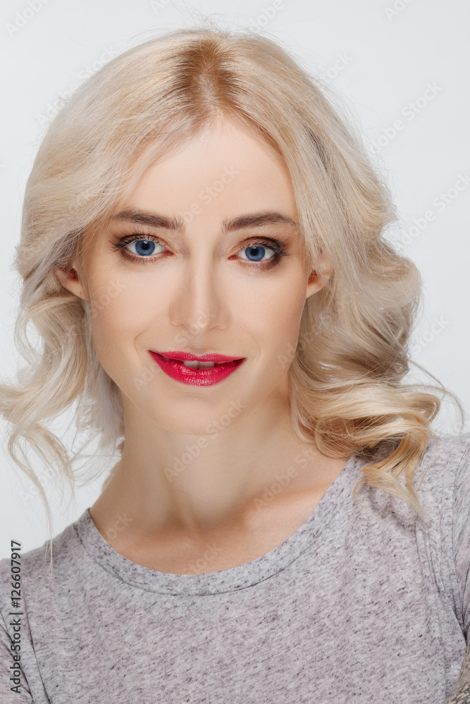 White hair fashion model with natural makeup, blue eyes and red White hair fashion model with natural makeup, blue eyes and red