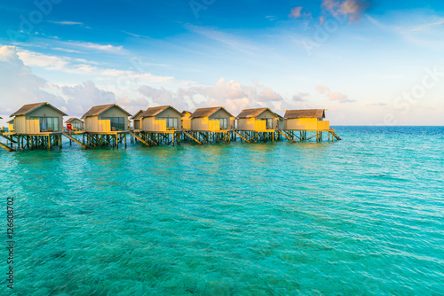 Fototapeta Naklejka Na Ścianę i Meble -  Beautiful water villas in tropical Maldives island at the sunris