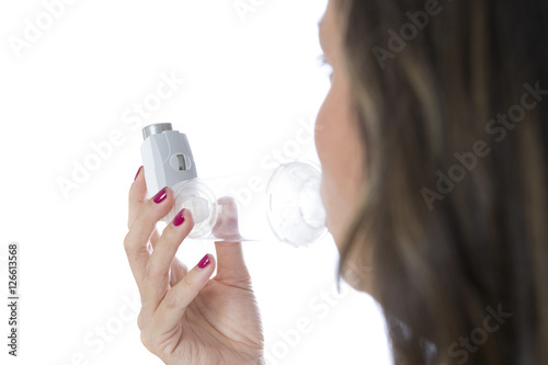 Canvas Print Woman inhales a medicament from a space chamber