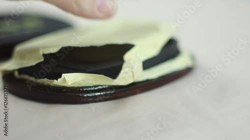Girl Pulls Out the Inkwell Calligraphy From the Wooden Box. Black Ink With a Pattern 1