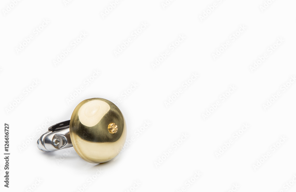 Golden bicycle bell on a white Golden bicycle bell on a white