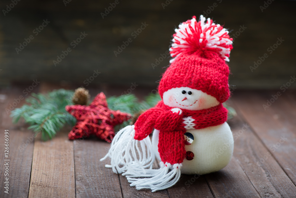 Obraz premium Snowman on wooden table. Christmas decoration. Copy space.
