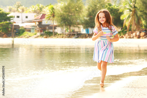 little girl have fun on the beach © yuliyatrukhan