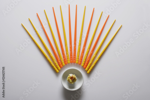 Wallpaper Mural Orange and yellow chopsticks lined up over dim sum. Torontodigital.ca